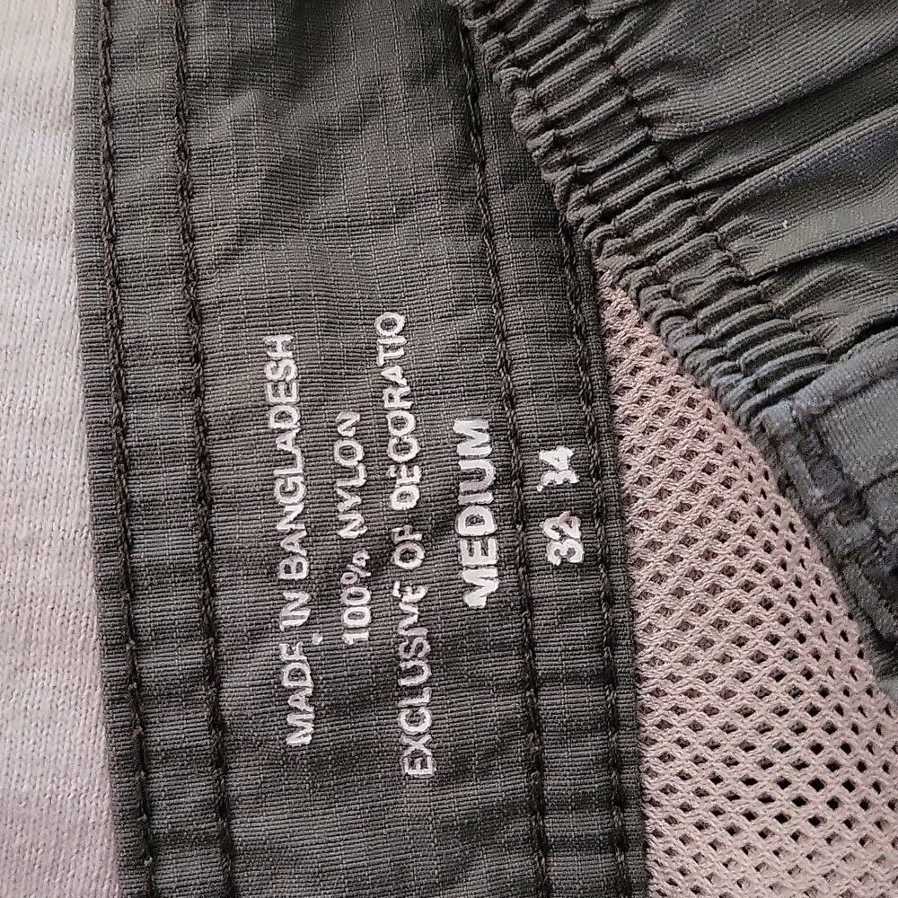 Mens Coleman olive green nylon shorts.